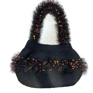 Unique Statement purse woven with black,orange,red feathery details.